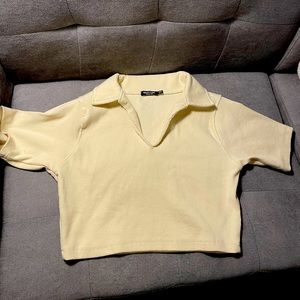 Vanilla cream colored cropped polo from nasty gal